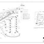 Construction plan sheet showing a segmental block retaining wall layout.