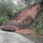 Slope failure obstructing right-of-way traffic.