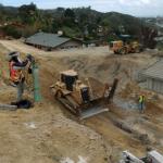 Taking measurements on a slope  during grading operations