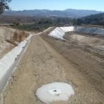 Inclinometer installation for monitoring slope movement at landfill.