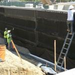 Subdrain Installation Behind Site Retaining Wall.