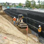 Compaction Operations Behind Site Retaining Wall.